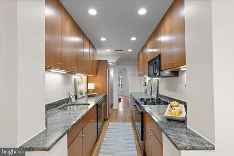 a kitchen with granite countertop lots of counter top space