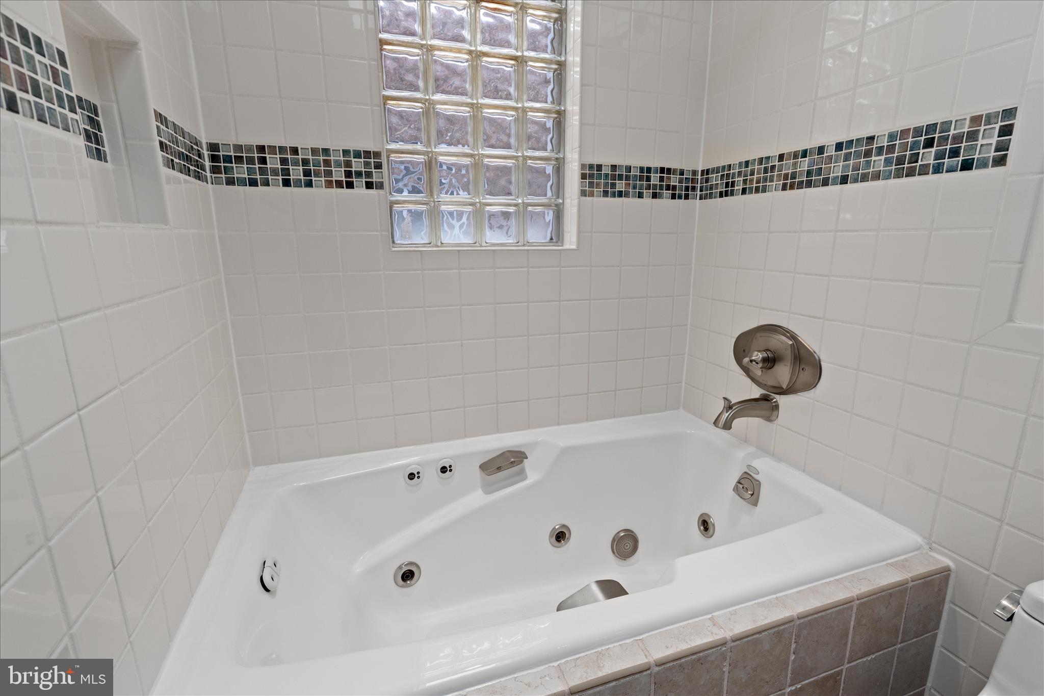 2744 Woodley Place Northwest Washington, DC 20008 - Photo 30 of 41 a bathroom with a bathtub and a shower