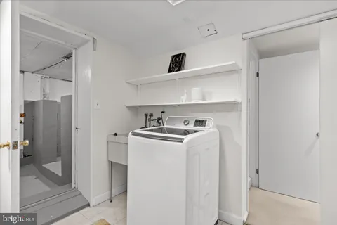 a view of storage and utility room with washer and dryer