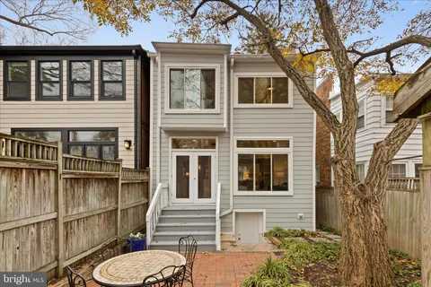 a view of a brick house with a large windows
