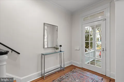 a view of an entryway with wooden floor