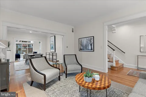 a living room with furniture and a table