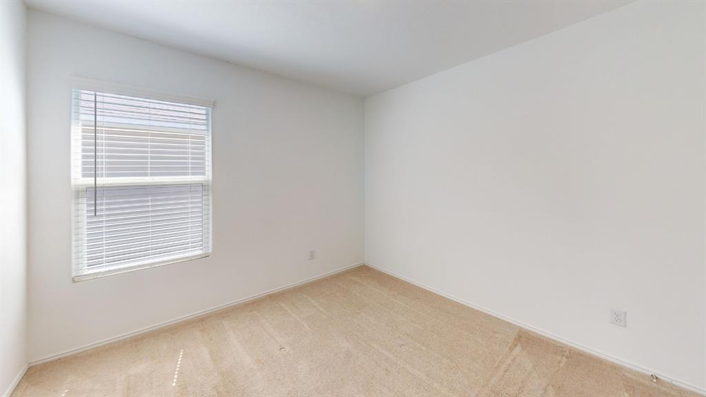 403 Ashbrook Way Princeton, TX 75407 - Photo 13 of 23 Room featuring light-toned carpeting and a single window with white blinds
