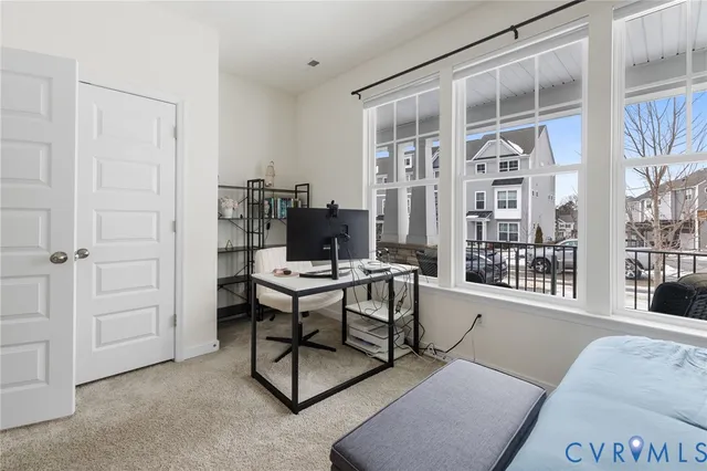 a view of a livingroom with furniture and a window