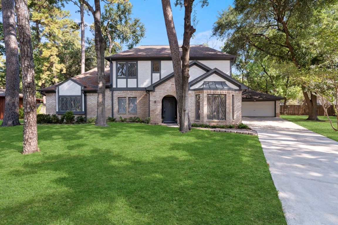 5402 Summerfield Lane Spring, TX 77379 - Photo 1 of 32 a front view of a house with garden