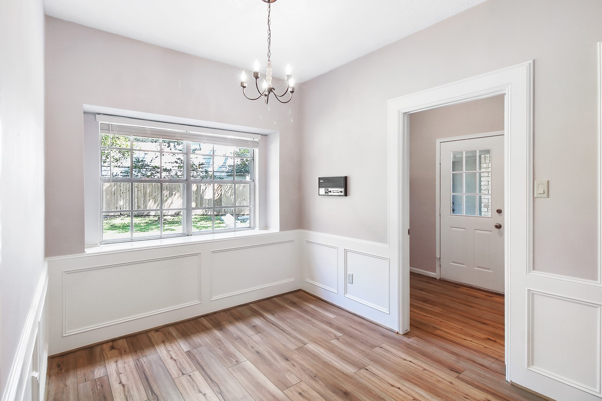 5402 Summerfield Lane Spring, TX 77379 - Photo 12 of 32 a view of an empty room with wooden floor and a window