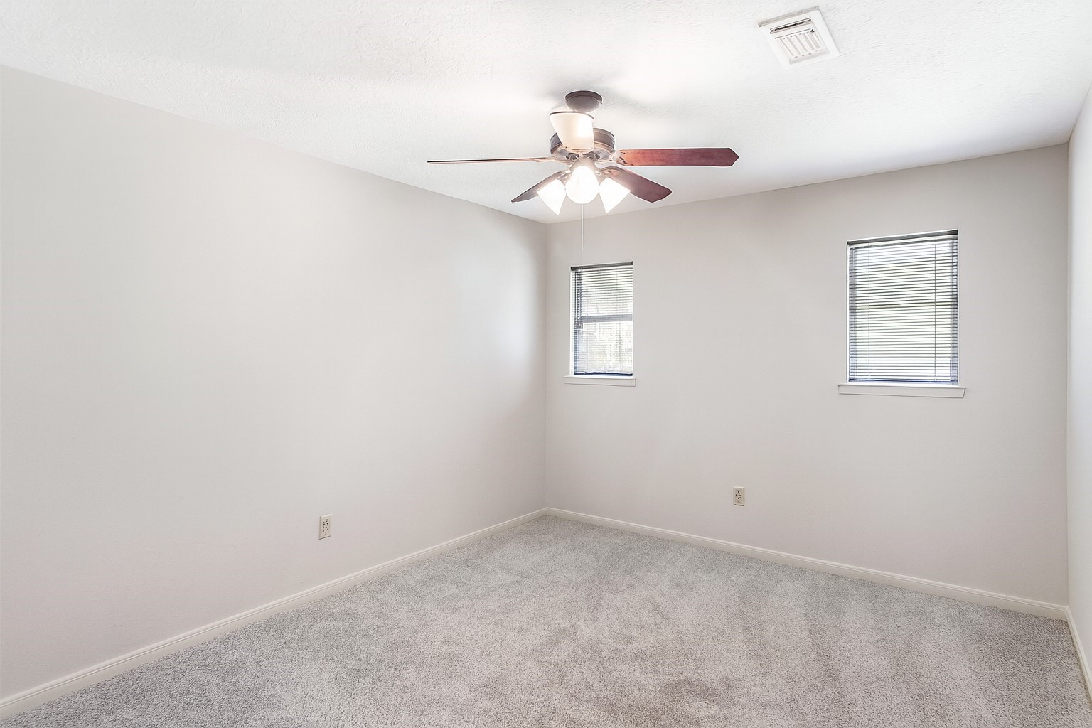 5402 Summerfield Lane Spring, TX 77379 - Photo 26 of 32 an empty room with a window and ceiling fan