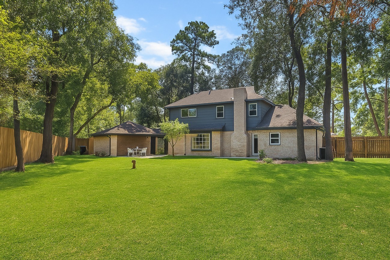 5402 Summerfield Lane Spring, TX 77379 - Photo 28 of 32 front view of a house with a big yard