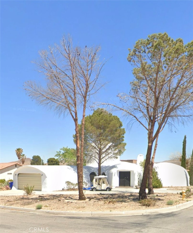 26325 Edgewater Lane Helendale, CA 92342 - Photo 2 of 3 a front view of a house with a yard