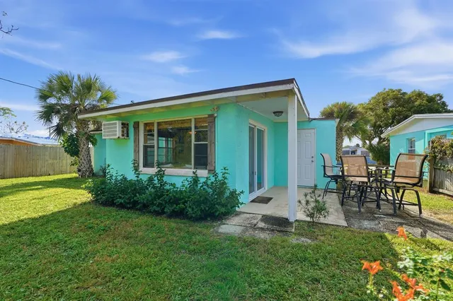 a view of a yard with a tree