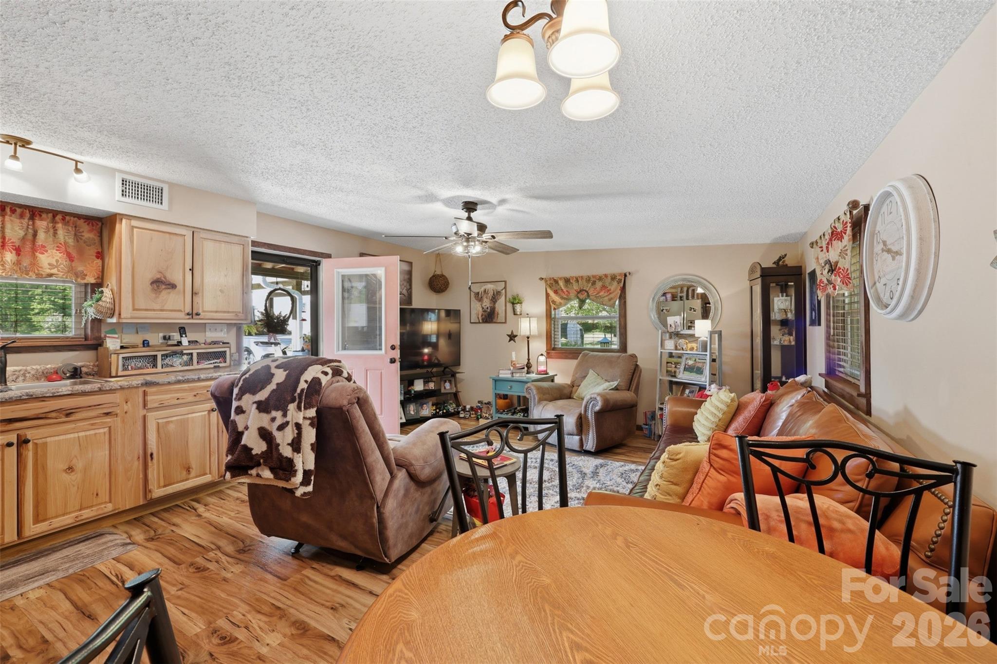 176-174 Oak Hollow Road Union Grove, NC 28689 - Photo 35 of 48 a living room with lots of furniture and chandelier