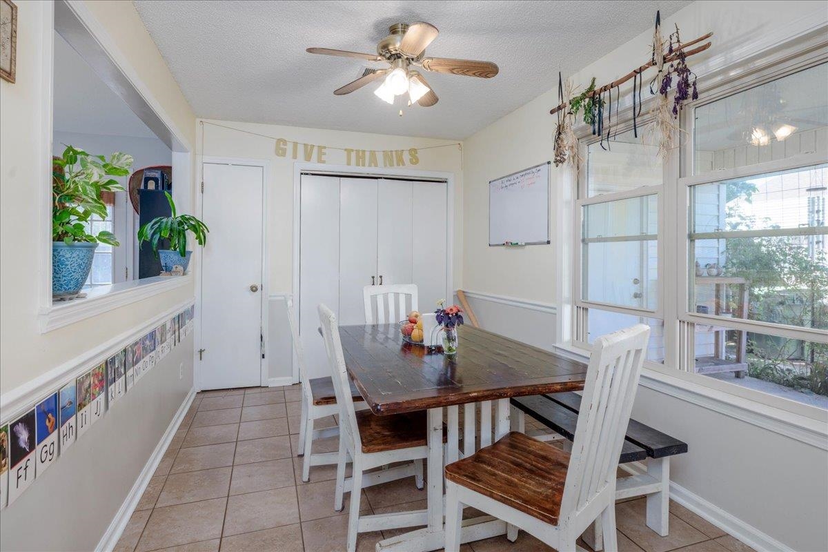4357 Water Briar Road Millington, TN 38053 - Photo 11 of 29 Tiled dining area featuring a textured ceiling and ceiling fan