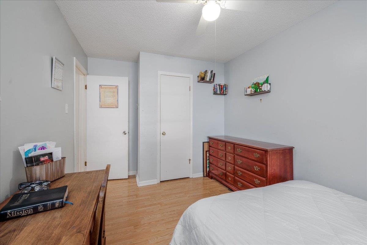 4357 Water Briar Road Millington, TN 38053 - Photo 17 of 29 Bedroom with a textured ceiling, light hardwood / wood-style flooring, and ceiling fan