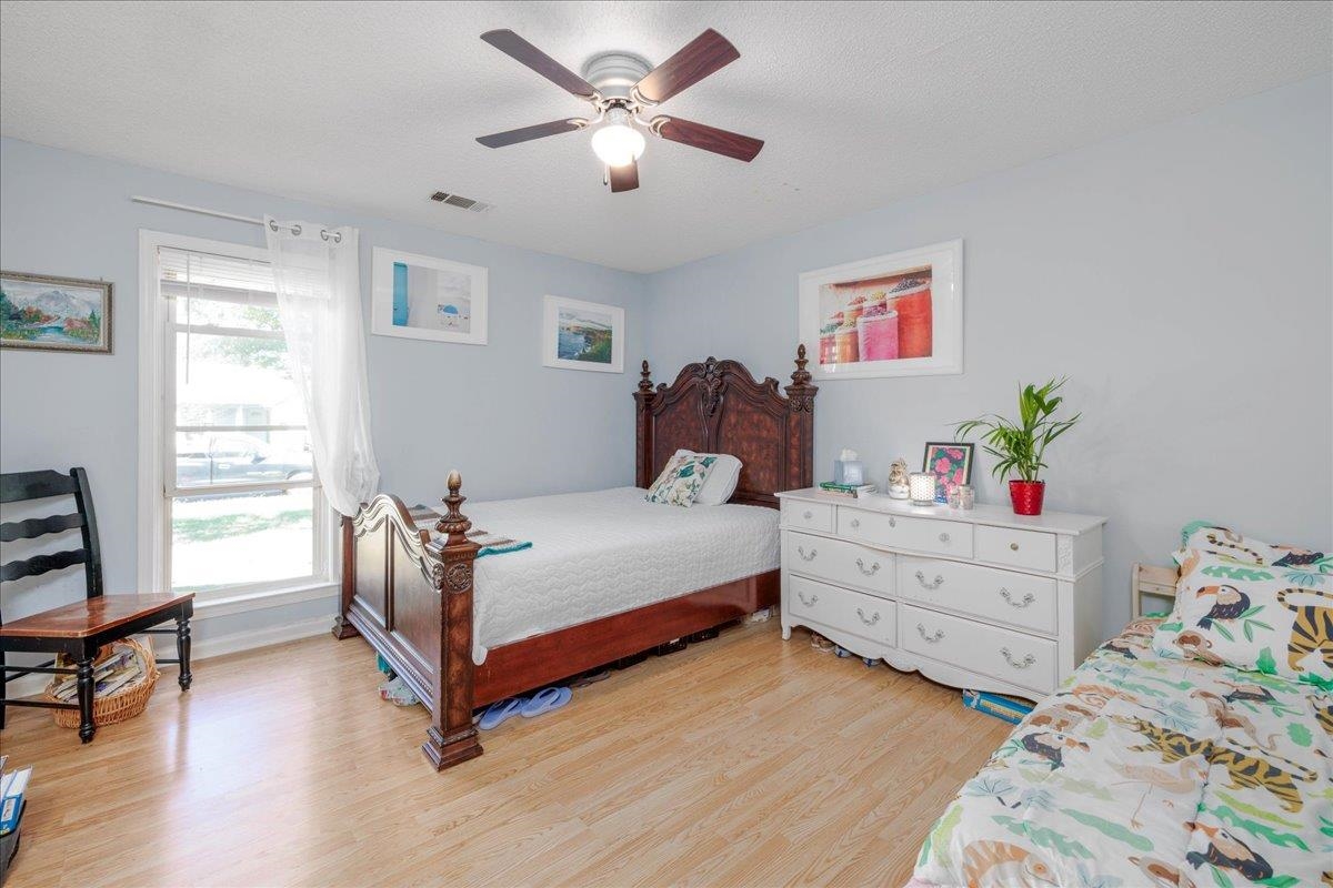 4357 Water Briar Road Millington, TN 38053 - Photo 19 of 29 Bedroom with ceiling fan, light hardwood / wood-style floors, and a textured ceiling