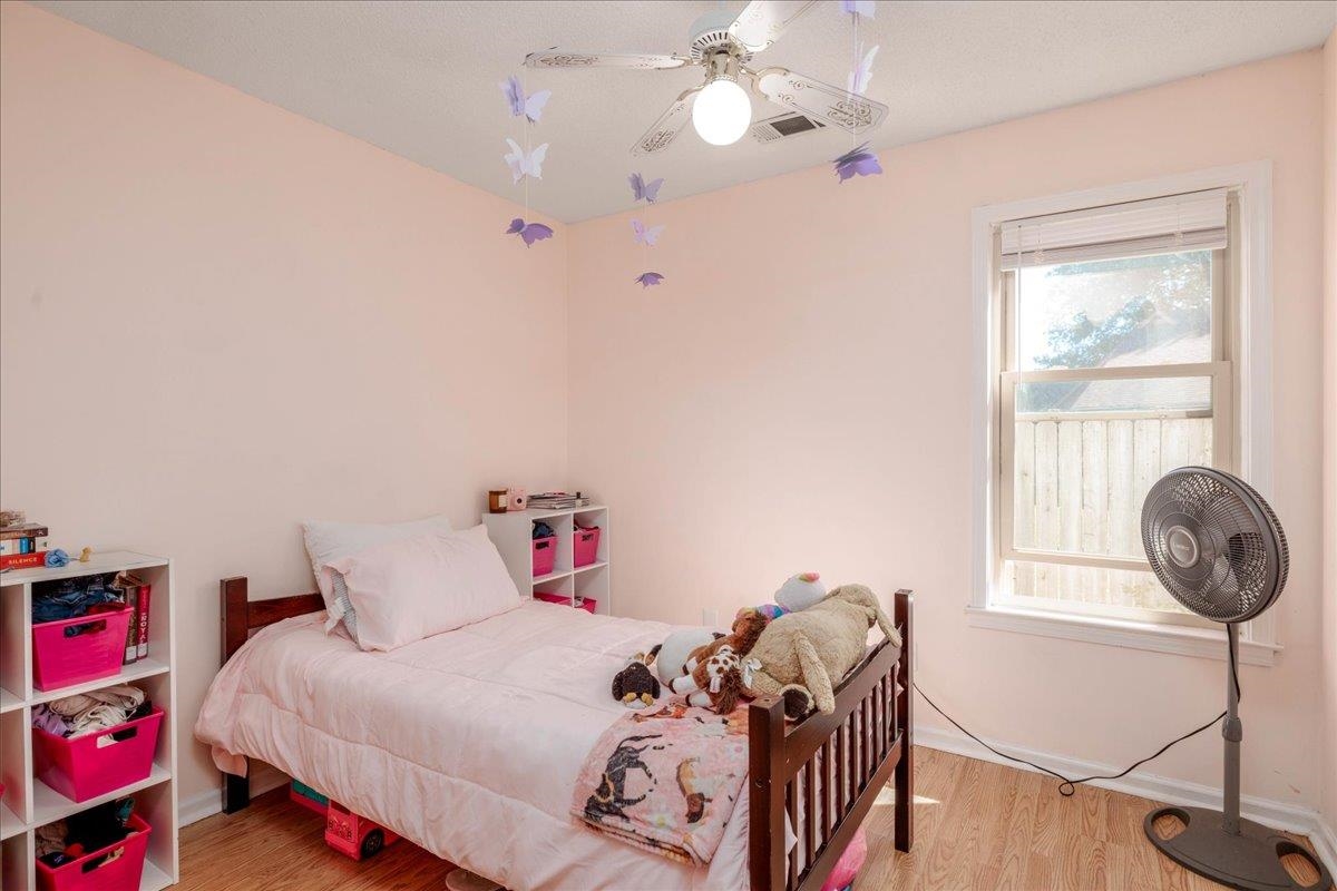 4357 Water Briar Road Millington, TN 38053 - Photo 21 of 29 Bedroom with ceiling fan, light hardwood / wood-style flooring, and multiple windows