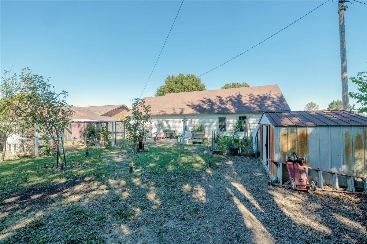 4357 Water Briar Road Millington, TN 38053 - Photo 27 of 29 Back of property featuring a lawn and an outbuilding
