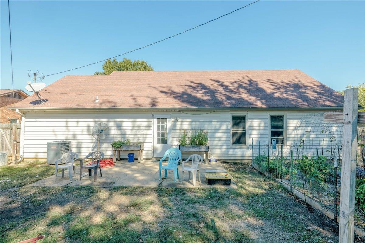 4357 Water Briar Road Millington, TN 38053 - Photo 28 of 29 Rear view of property featuring a lawn, a patio area, and central AC