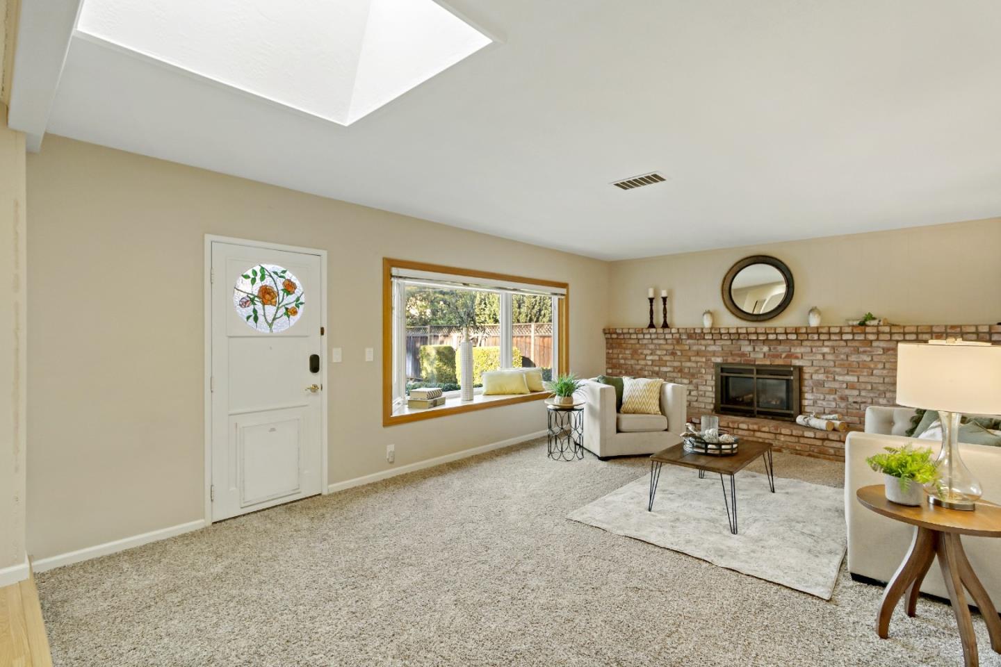 1287 Peralta Drive San Jose, CA 95120 - Photo 18 of 38 a living room with furniture a fireplace and a table