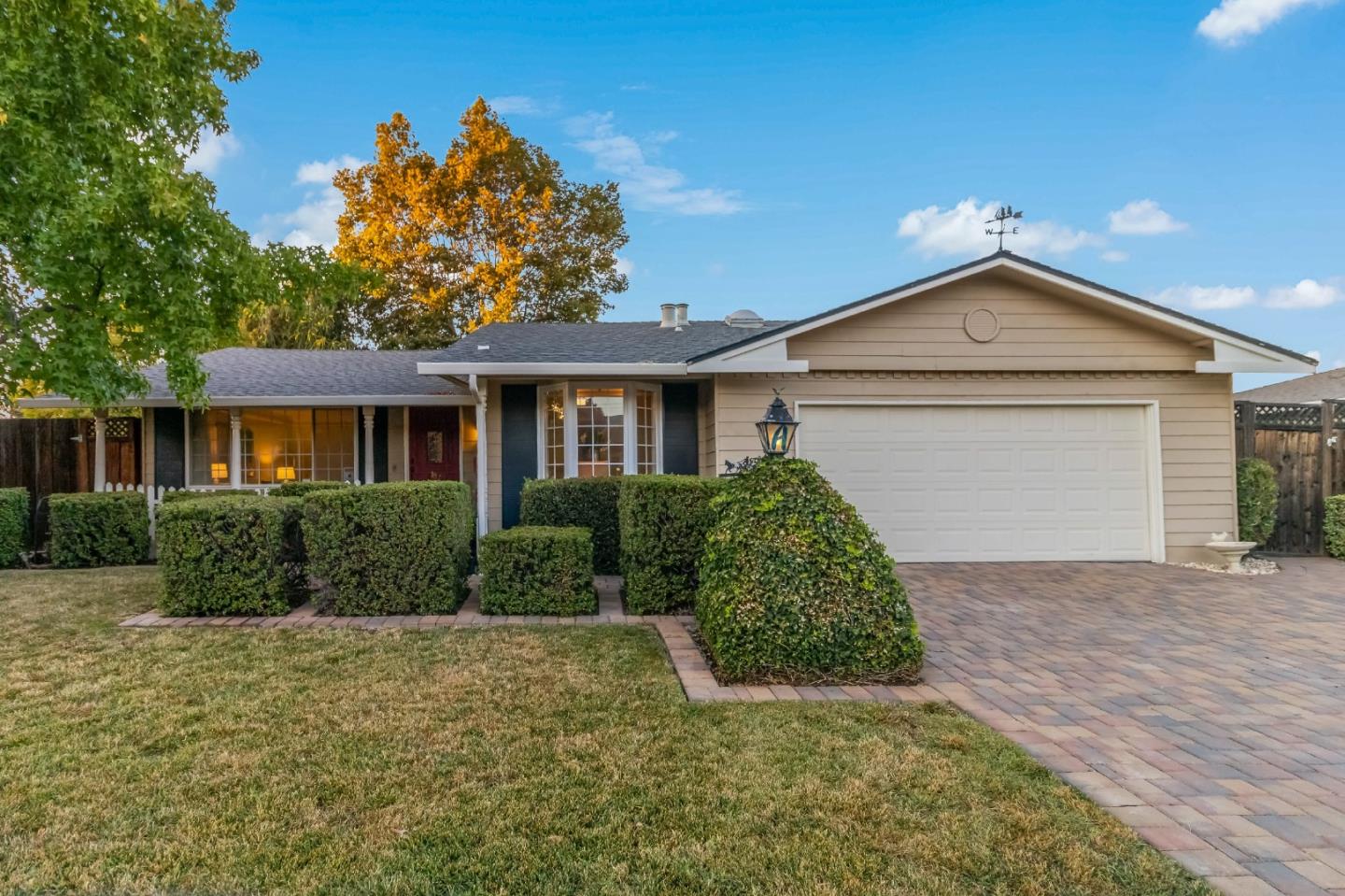 1287 Peralta Drive San Jose, CA 95120 - Photo 2 of 38 a front view of a house with a yard