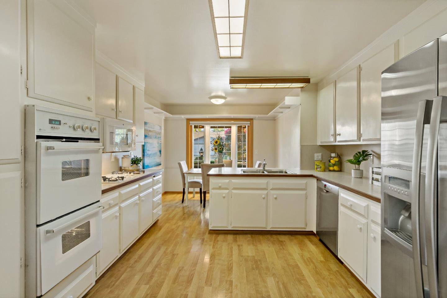 1287 Peralta Drive San Jose, CA 95120 - Photo 23 of 38 a kitchen with white cabinets and white appliances
