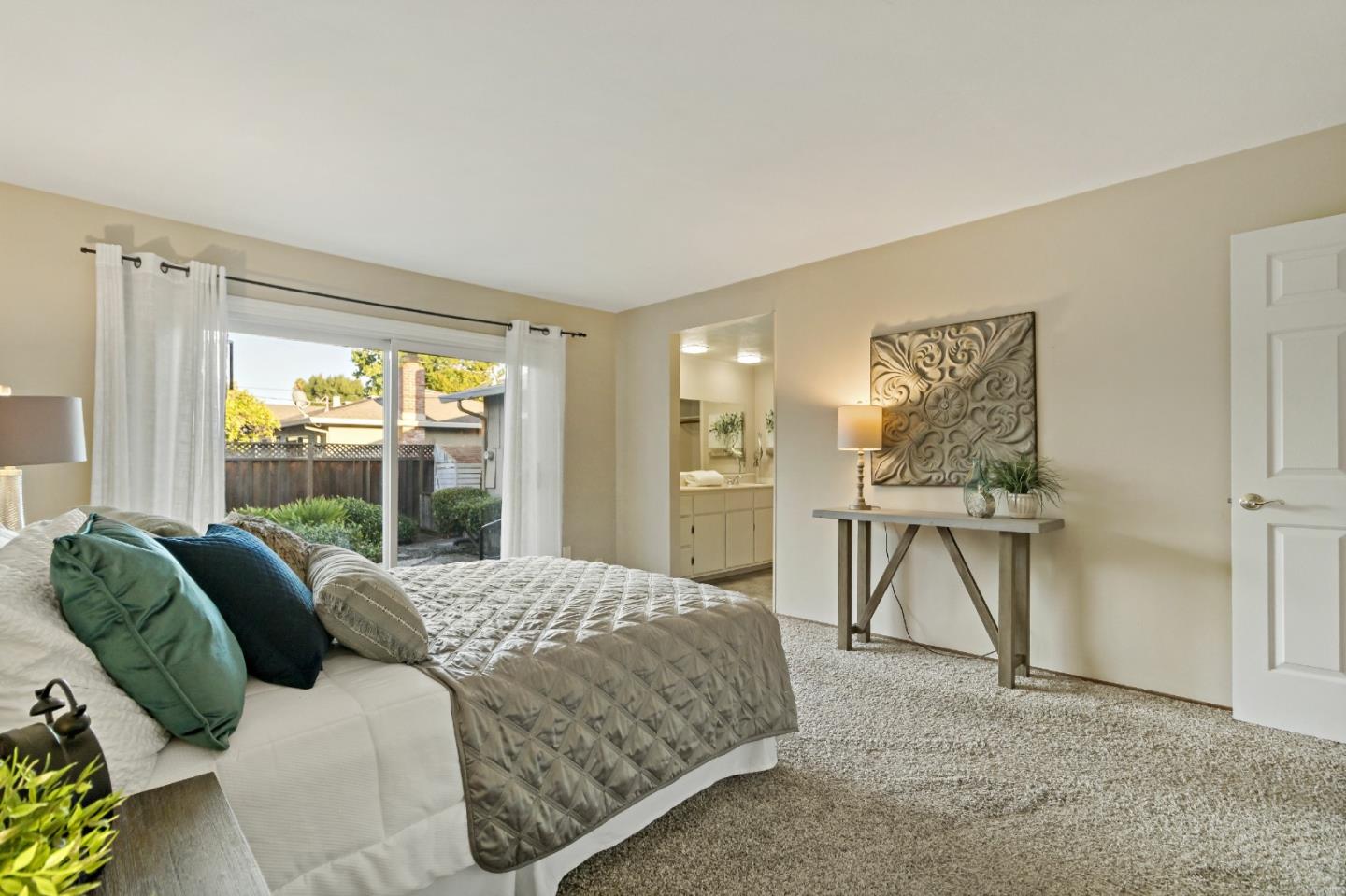 1287 Peralta Drive San Jose, CA 95120 - Photo 28 of 38 a bedroom with a bed and a table