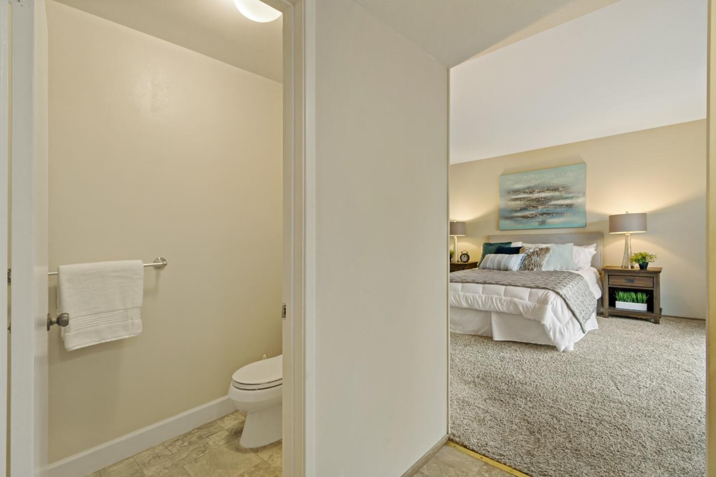 1287 Peralta Drive San Jose, CA 95120 - Photo 31 of 38 a spacious bedroom with a bed and a lamp