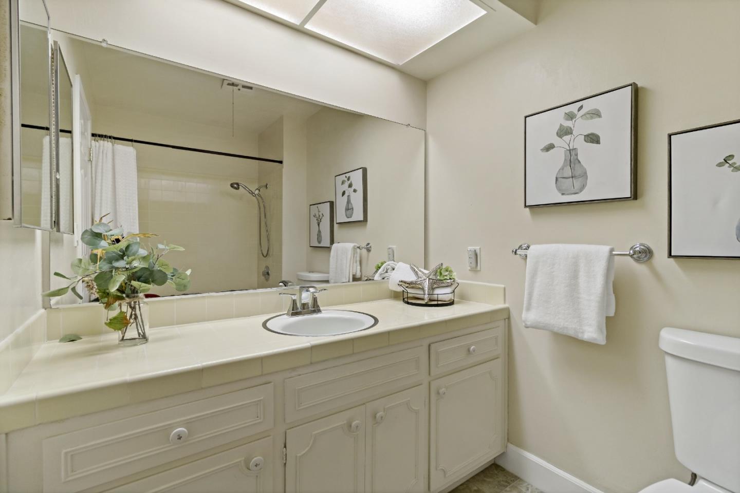 1287 Peralta Drive San Jose, CA 95120 - Photo 34 of 38 a bathroom with a sink a toilet and mirror