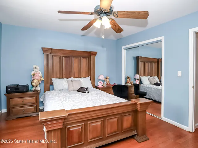 a bed room with a bed and a chandelier