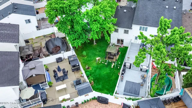 an aerial view of house with yard