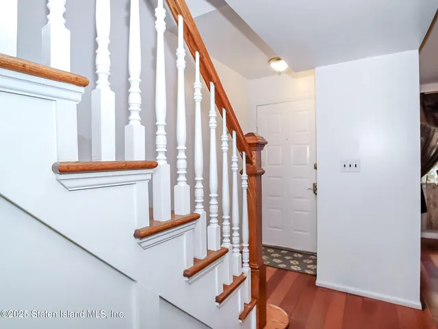 a view of staircase with a rug