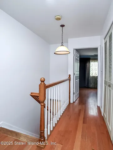 a view of a hallway view with staircase