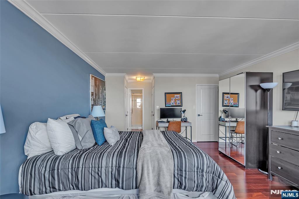 250 Gorge Road, Unit 21B Cliffside Park, NJ 07010 - Photo 18 of 37 a bedroom with a bed and wooden floor