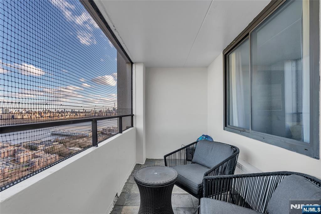 250 Gorge Road, Unit 21B Cliffside Park, NJ 07010 - Photo 20 of 37 a view of a balcony and chairs