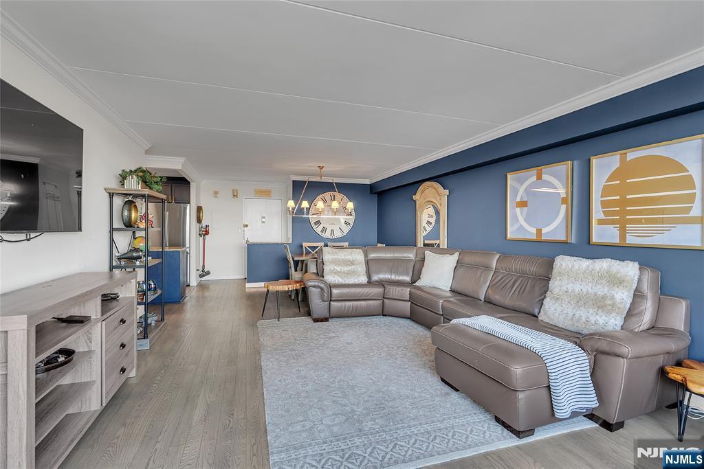 250 Gorge Road, Unit 21B Cliffside Park, NJ 07010 - Photo 2 of 37 a living room with furniture and a flat screen tv