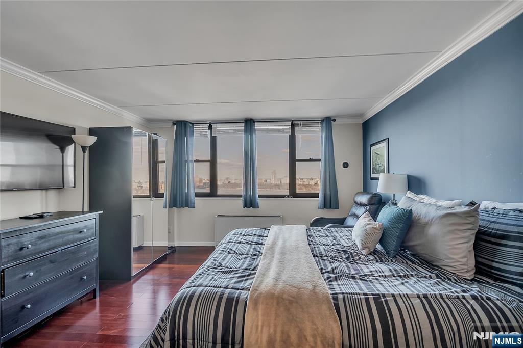 250 Gorge Road, Unit 21B Cliffside Park, NJ 07010 - Photo 22 of 37 a bedroom with a bed and large windows