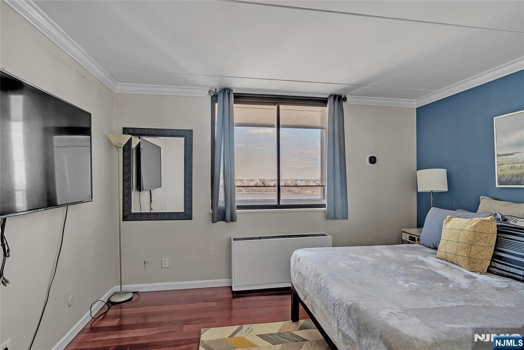 250 Gorge Road, Unit 21B Cliffside Park, NJ 07010 - Photo 24 of 37 a bedroom with a bed and a large window