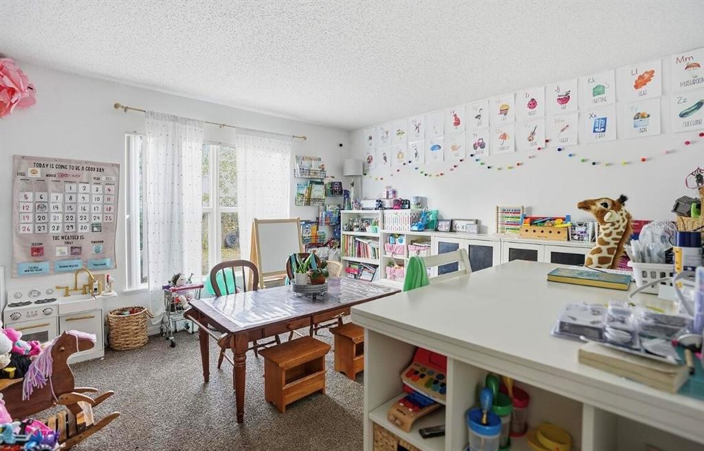 11077 Jenny Wren Road Weeki Wachee, FL 34614 - Photo 17 of 42 a room with furniture a couch and a large window