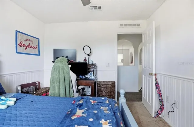 a view of a livingroom with furniture and workspace
