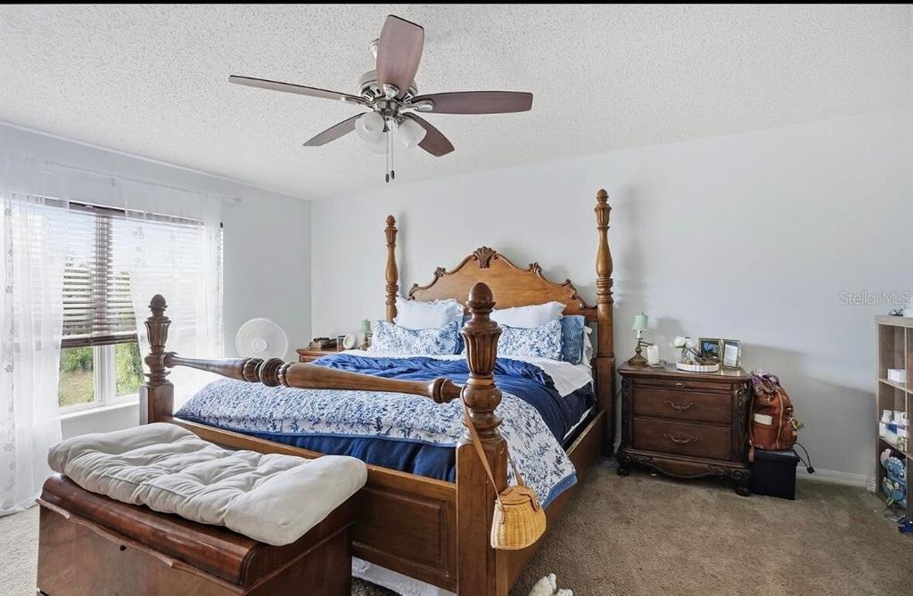 11077 Jenny Wren Road Weeki Wachee, FL 34614 - Photo 28 of 42 a bedroom with bed and window