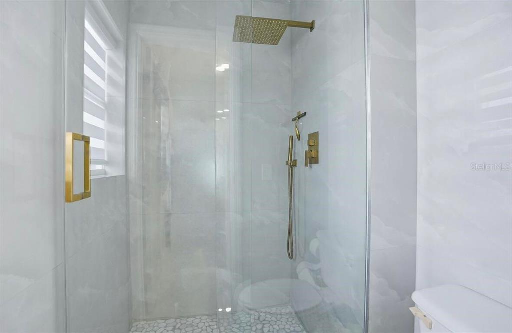 11077 Jenny Wren Road Weeki Wachee, FL 34614 - Photo 31 of 42 a bathroom with a shower