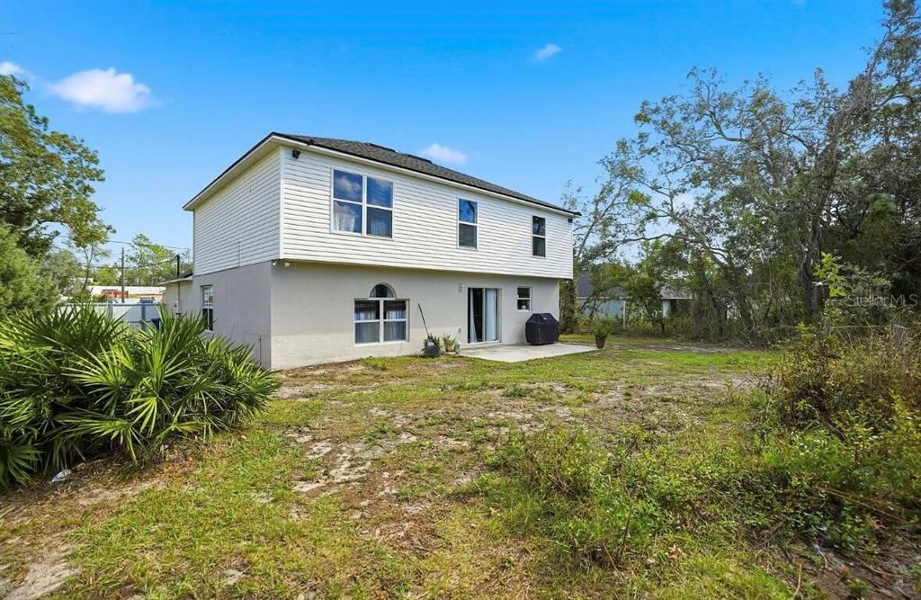 11077 Jenny Wren Road Weeki Wachee, FL 34614 - Photo 34 of 42 a view of a house with a yard