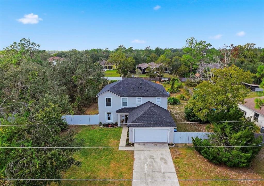 11077 Jenny Wren Road Weeki Wachee, FL 34614 - Photo 38 of 42 a front view of a house with a yard
