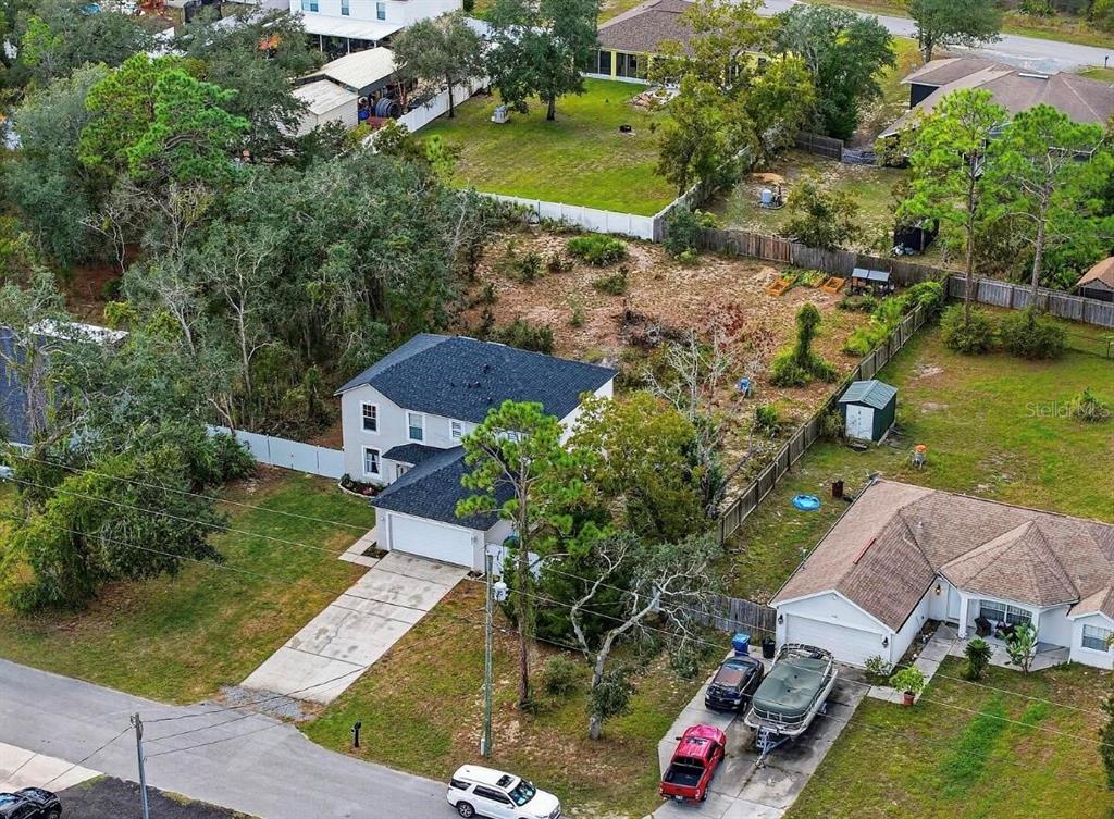11077 Jenny Wren Road Weeki Wachee, FL 34614 - Photo 40 of 42 an aerial view of a house with a yard