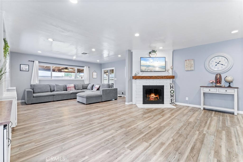 7932 Euclid Avenue Whittier, CA 90602 - Photo 12 of 31 a living room with furniture and a fireplace