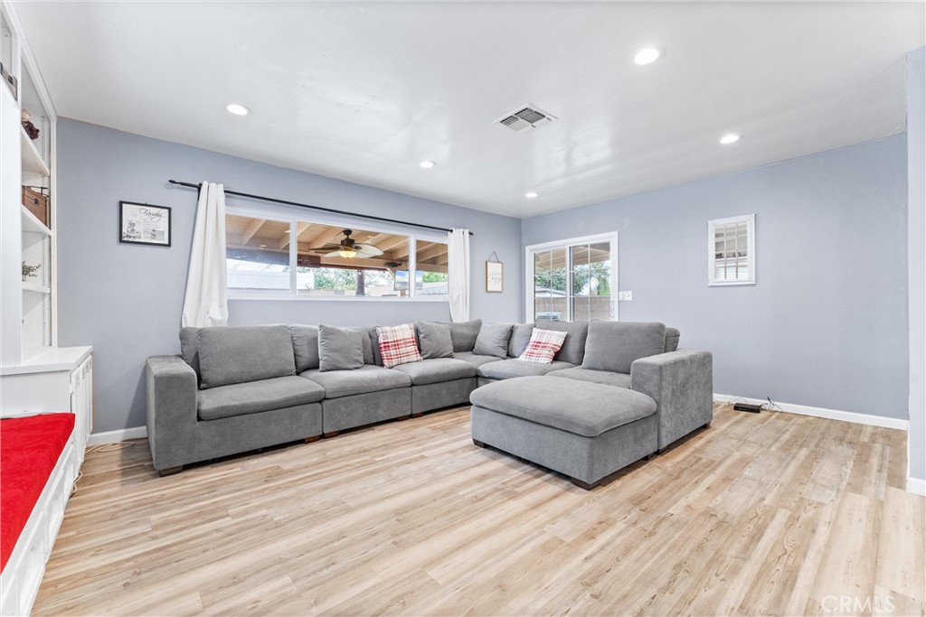 7932 Euclid Avenue Whittier, CA 90602 - Photo 14 of 31 a living room with furniture and a large window