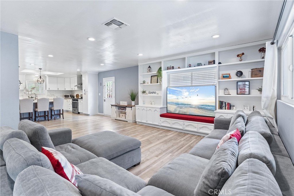 7932 Euclid Avenue Whittier, CA 90602 - Photo 16 of 31 a living room with furniture and a couch