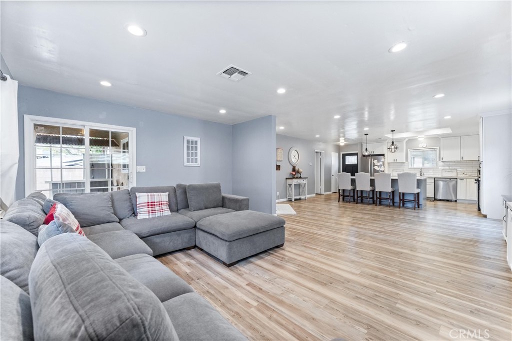 7932 Euclid Avenue Whittier, CA 90602 - Photo 17 of 31 a living room with furniture and a wooden floor