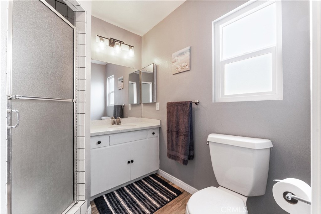 7932 Euclid Avenue Whittier, CA 90602 - Photo 20 of 31 a bathroom with a toilet sink and mirror