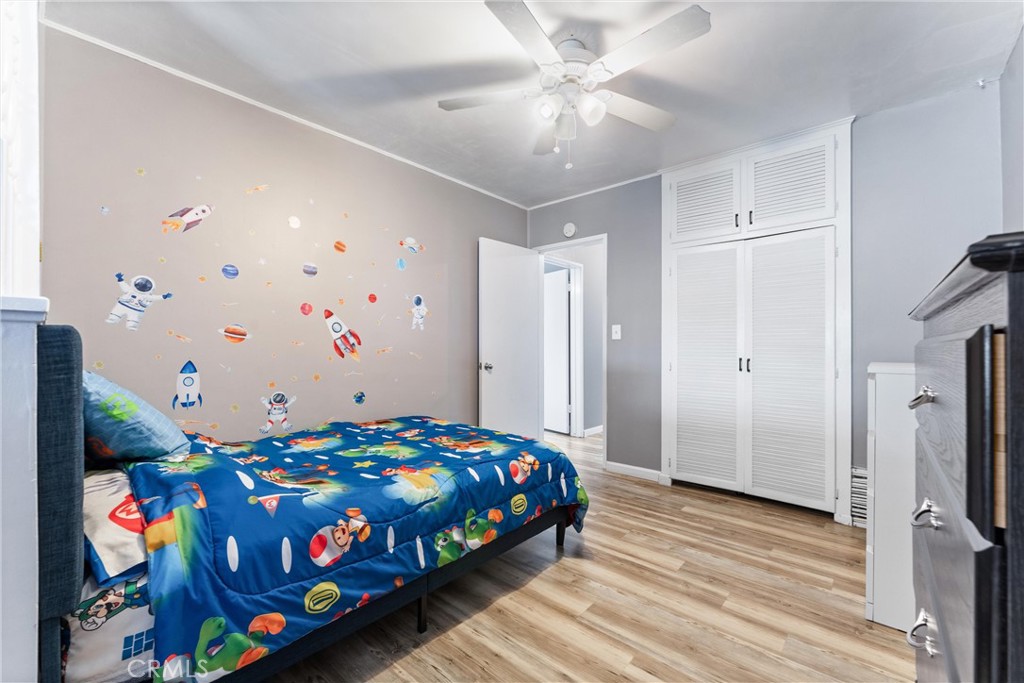 7932 Euclid Avenue Whittier, CA 90602 - Photo 24 of 31 a bedroom with a bed and a tv in it