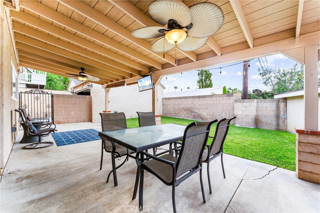 7932 Euclid Avenue Whittier, CA 90602 - Photo 27 of 31 a view of a patio with a table chairs and a backyard
